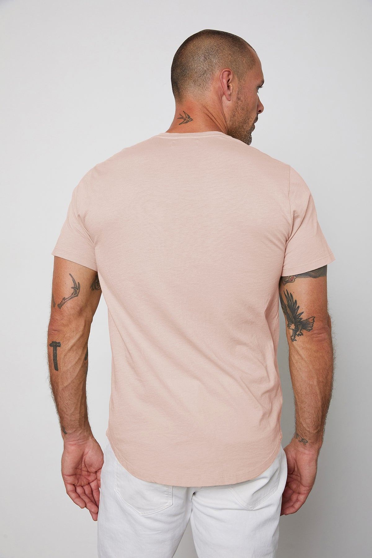   Fulton Short Sleeve Henley in light pink color bloom with white pants back view 