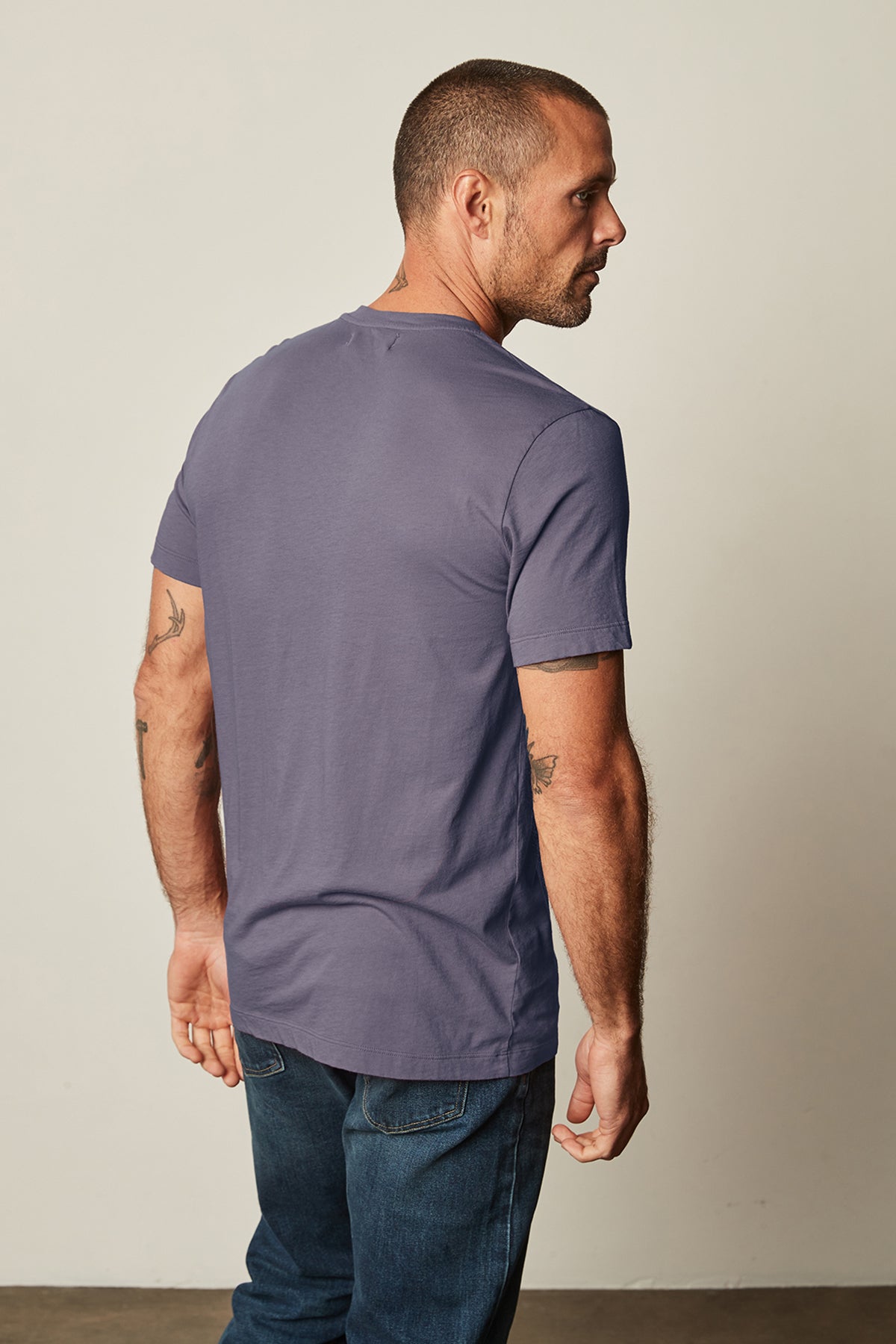 the back of a man wearing jeans and a Velvet by Graham & Spencer - HOWARD WHISPER CLASSIC CREW NECK TEE.-26630398673089