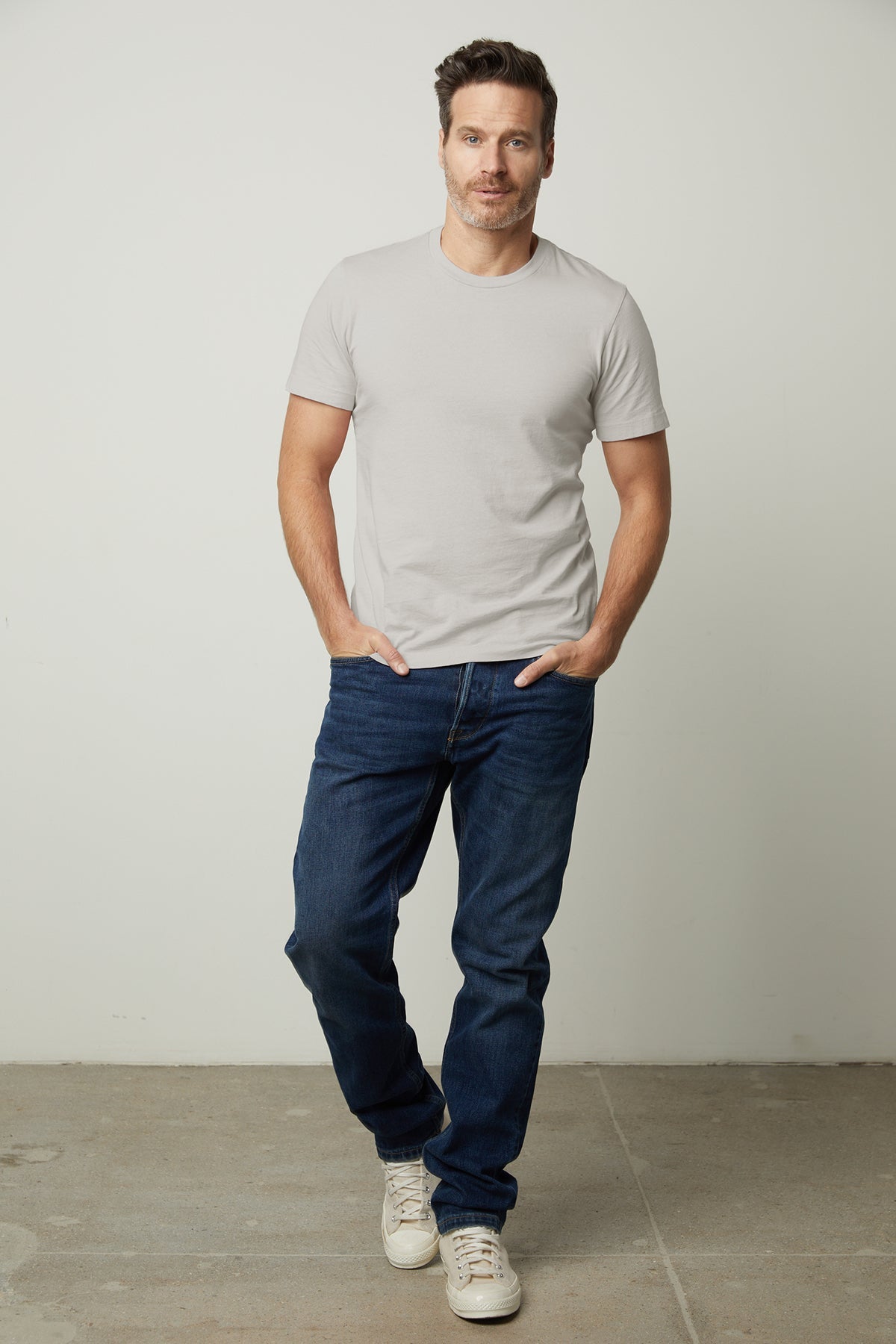   howard whisper classic crew neck tee in cement crew neck tee in cement front view with denim 