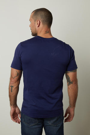 The back of a man wearing a Velvet by Graham & Spencer HOWARD WHISPER CLASSIC CREW NECK TEE with a flawless fit.
