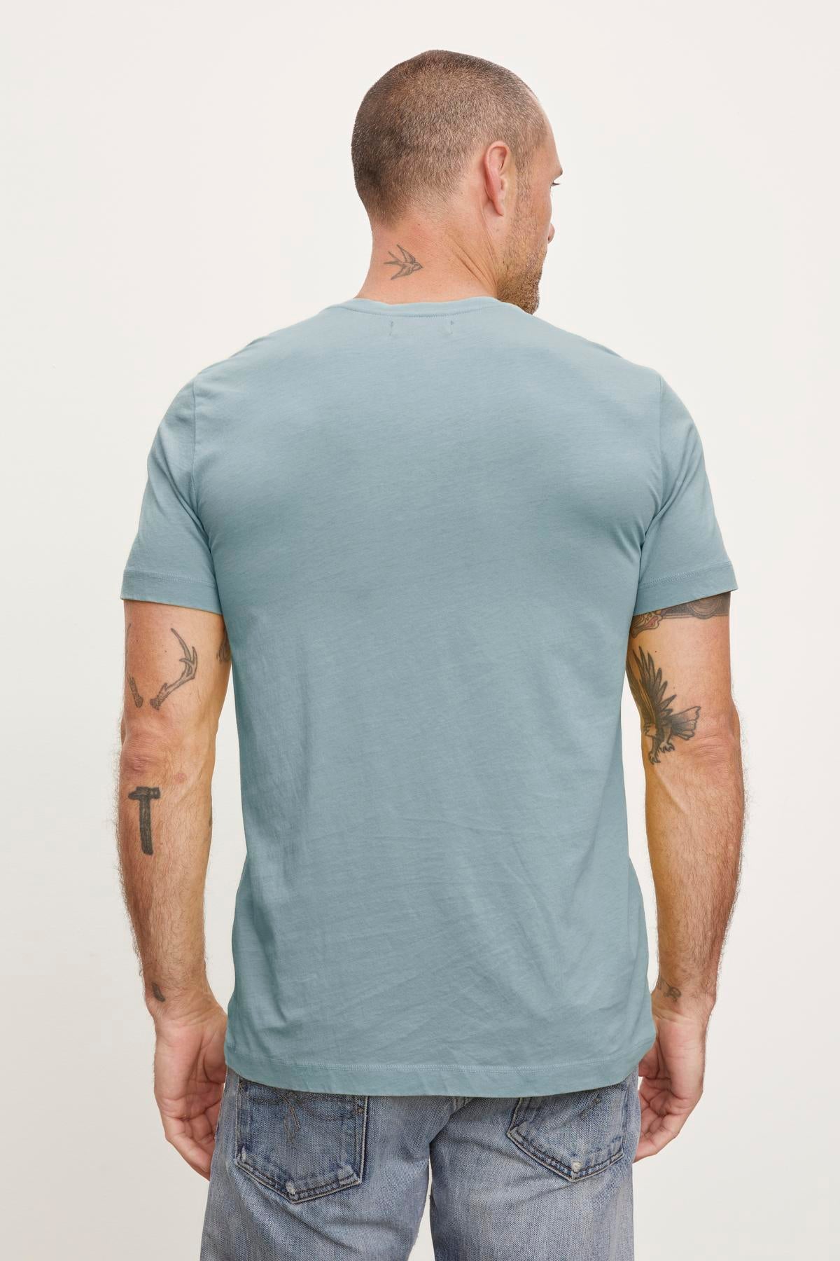 The back view of a man wearing a Velvet by Graham & Spencer HOWARD WHISPER CLASSIC CREW NECK TEE.-36009113780417