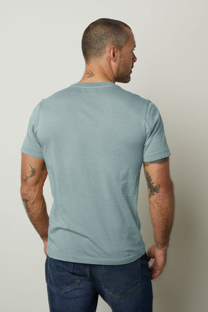 The back of a man wearing a Velvet by Graham & Spencer HOWARD WHISPER CLASSIC CREW NECK TEE with a vintage-feel softness.