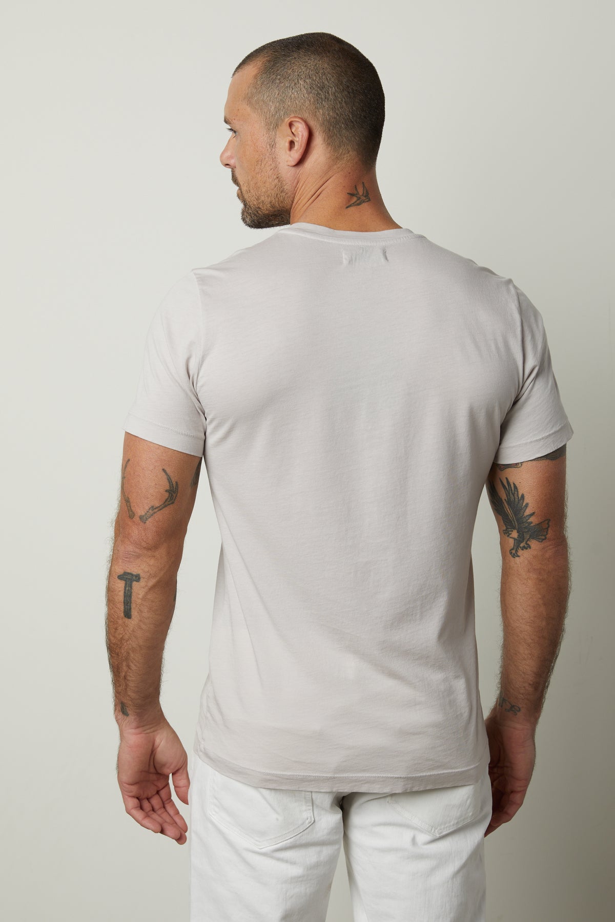 The back of a man wearing a Velvet by Graham & Spencer SAMSEN WHISPER CLASSIC V-NECK TEE.-35783134412993
