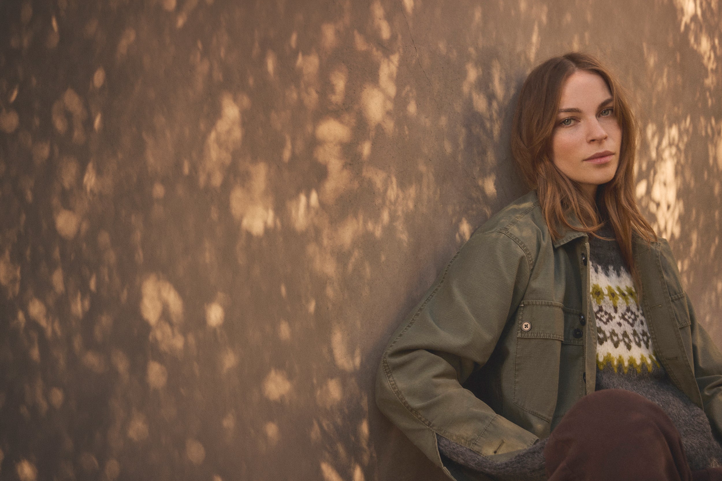 A woman outdoors wearing the Kay Shirt Jacket by Velvet by Graham & Spencer.
