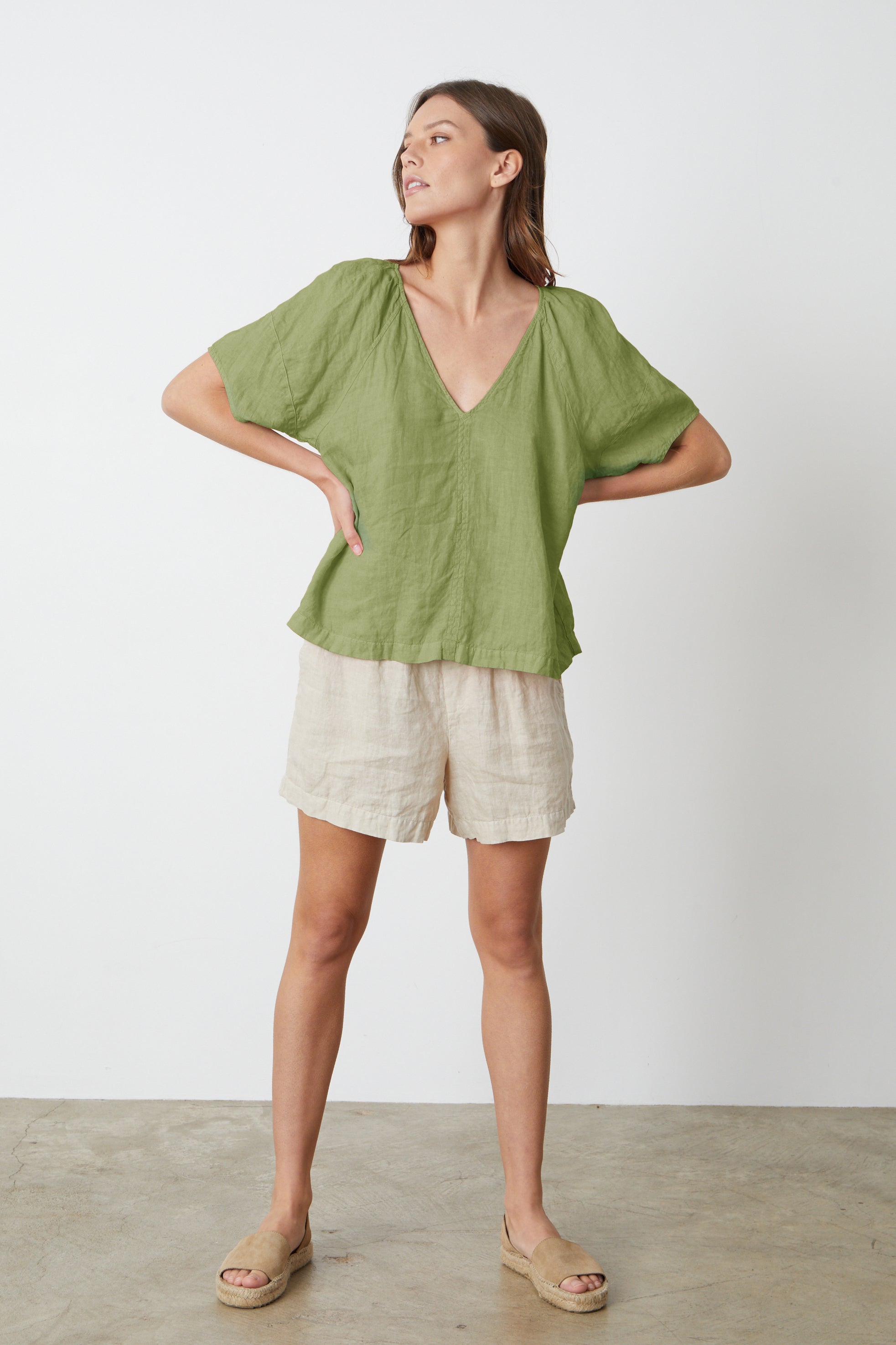   The model is wearing a Velvet by Graham & Spencer CALLIN PUFF SLEEVE LINEN TOP and Tammy shorts full length front. 