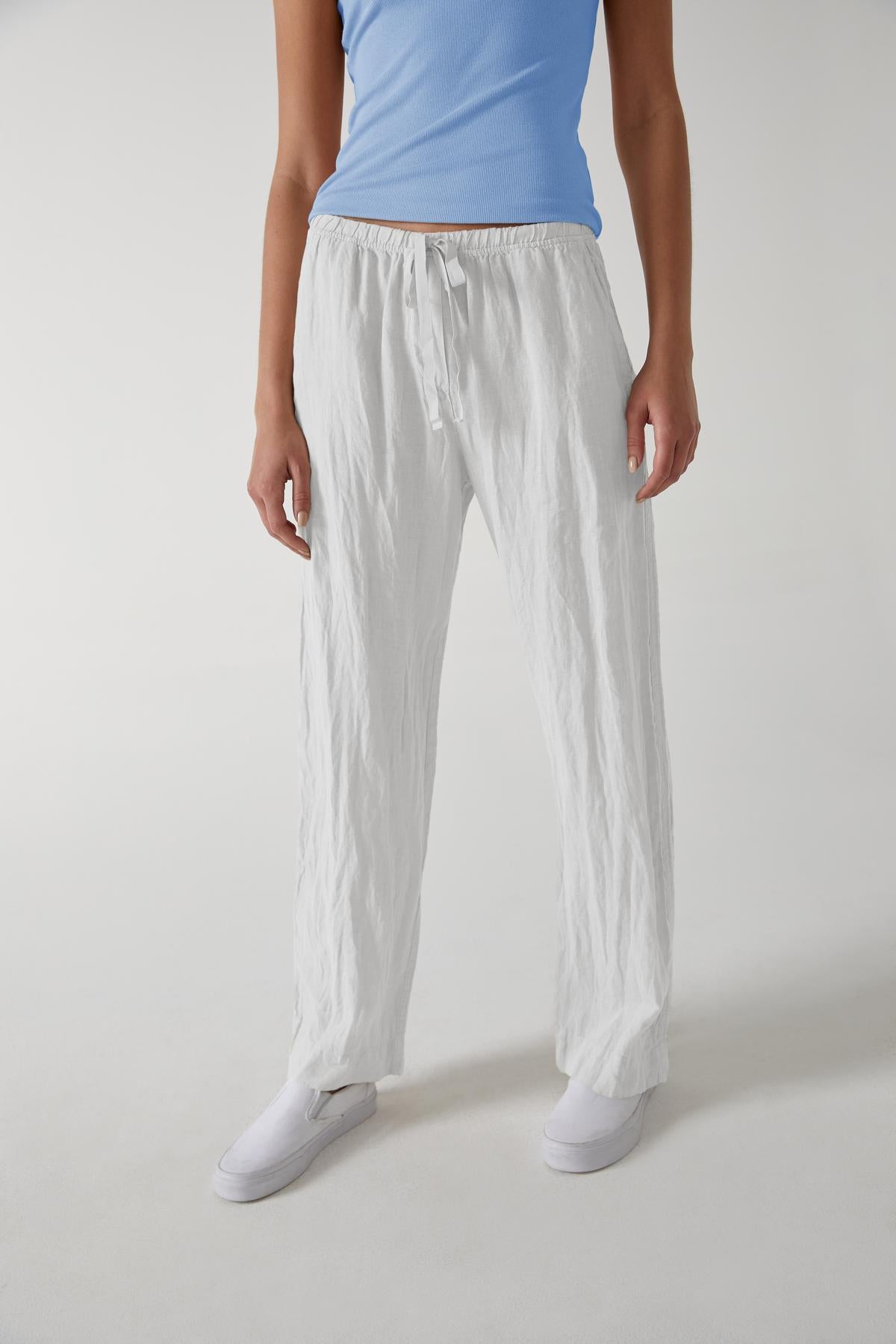 A woman wearing Velvet by Jenny Graham's PICO PANT and a blue t-shirt.-36168897724609