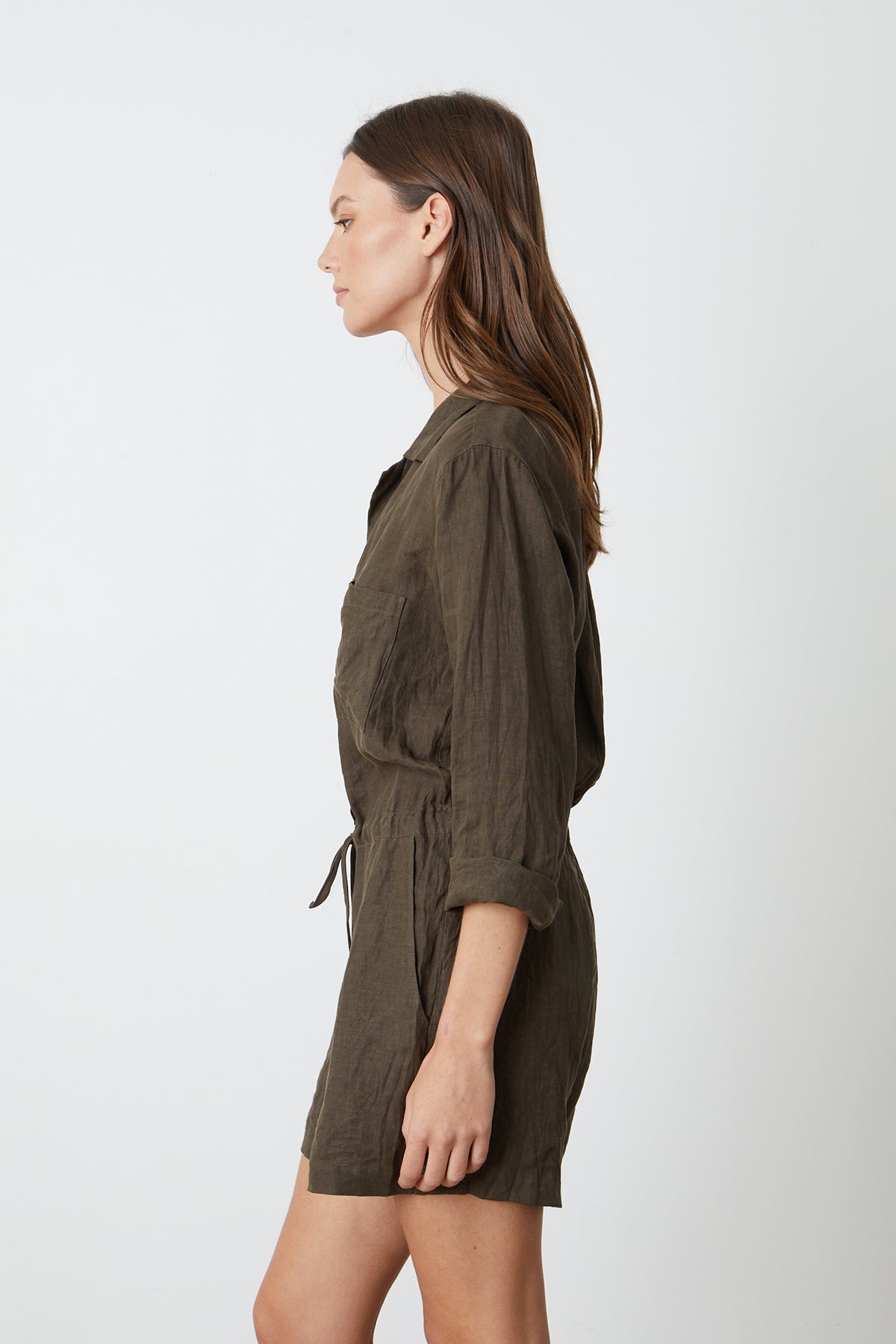   The sentence: the back view of a woman wearing an olive romper.
Revised sentence: the back view of a woman wearing the RUTH LINEN ROMPER by Velvet by Graham & Spencer. 