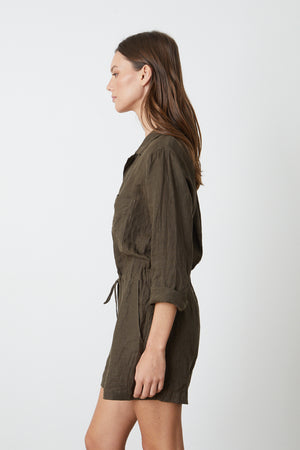 The sentence: the back view of a woman wearing an olive romper.
Revised sentence: the back view of a woman wearing the RUTH LINEN ROMPER by Velvet by Graham & Spencer.