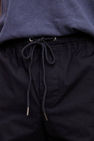 Close-up of a black drawstring with metal aglets on Velvet by Graham & Spencer's LAZARUS JOGGER under a blue sweatshirt.