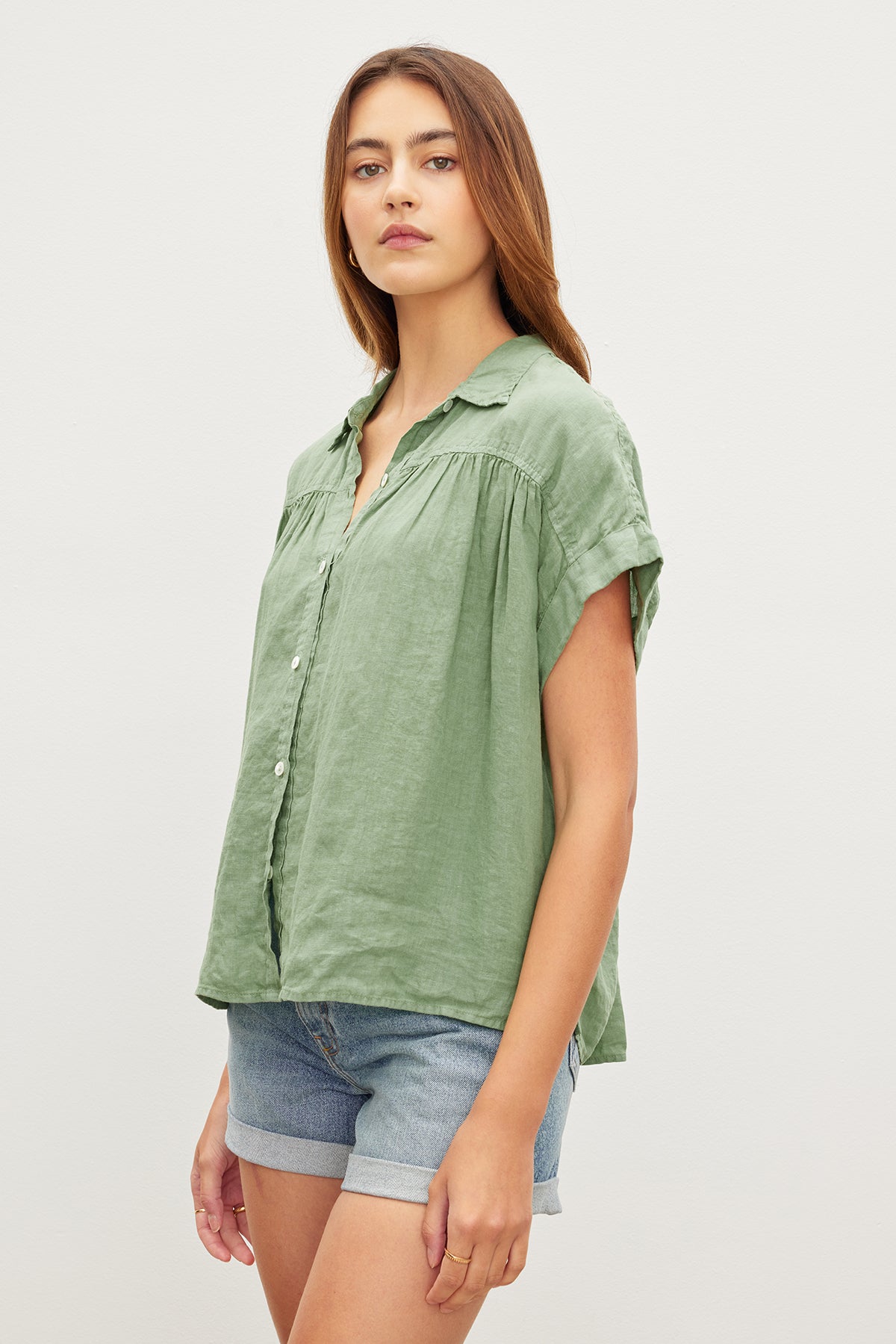 The ARIA LINEN BUTTON FRONT TOP in sage green from Velvet by Graham & Spencer offers both comfort and a classic appeal.-35955415056577