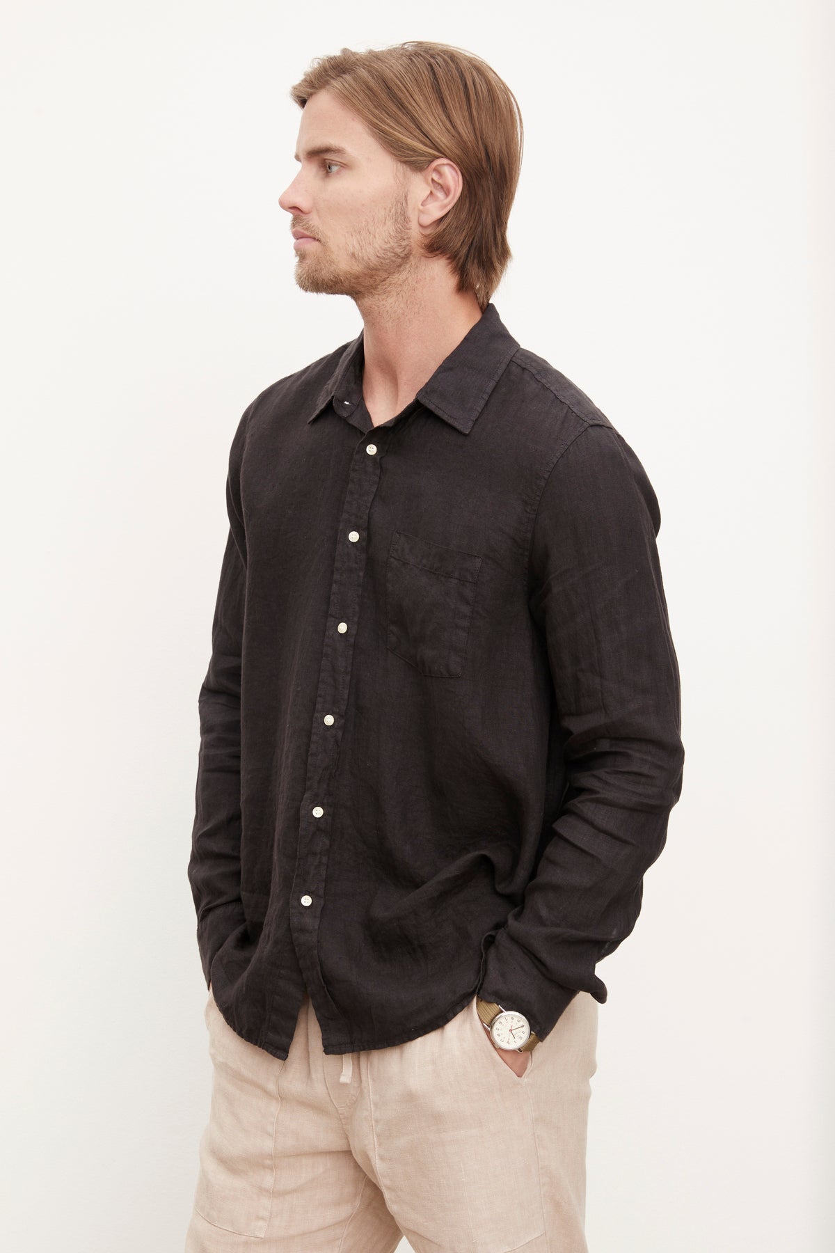   A stylish man in a Velvet by Graham & Spencer Benton Linen Button-Up Shirt. 