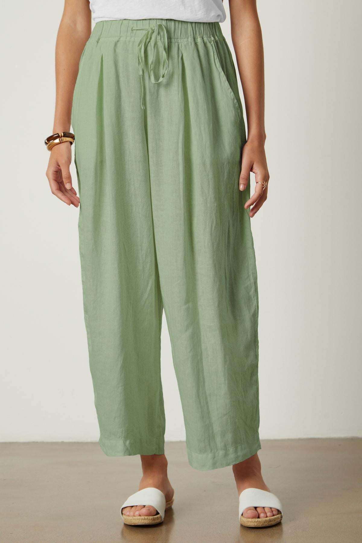 A woman wearing the Hannah Linen Wide Leg Pant by Velvet by Graham & Spencer.-35982790099137