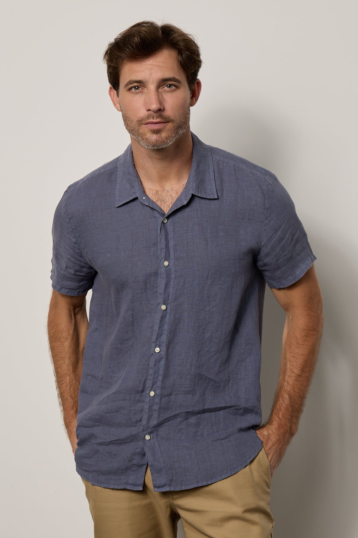   Mackie Button-Up Shirt in baltic blue linen with khaki pants front 