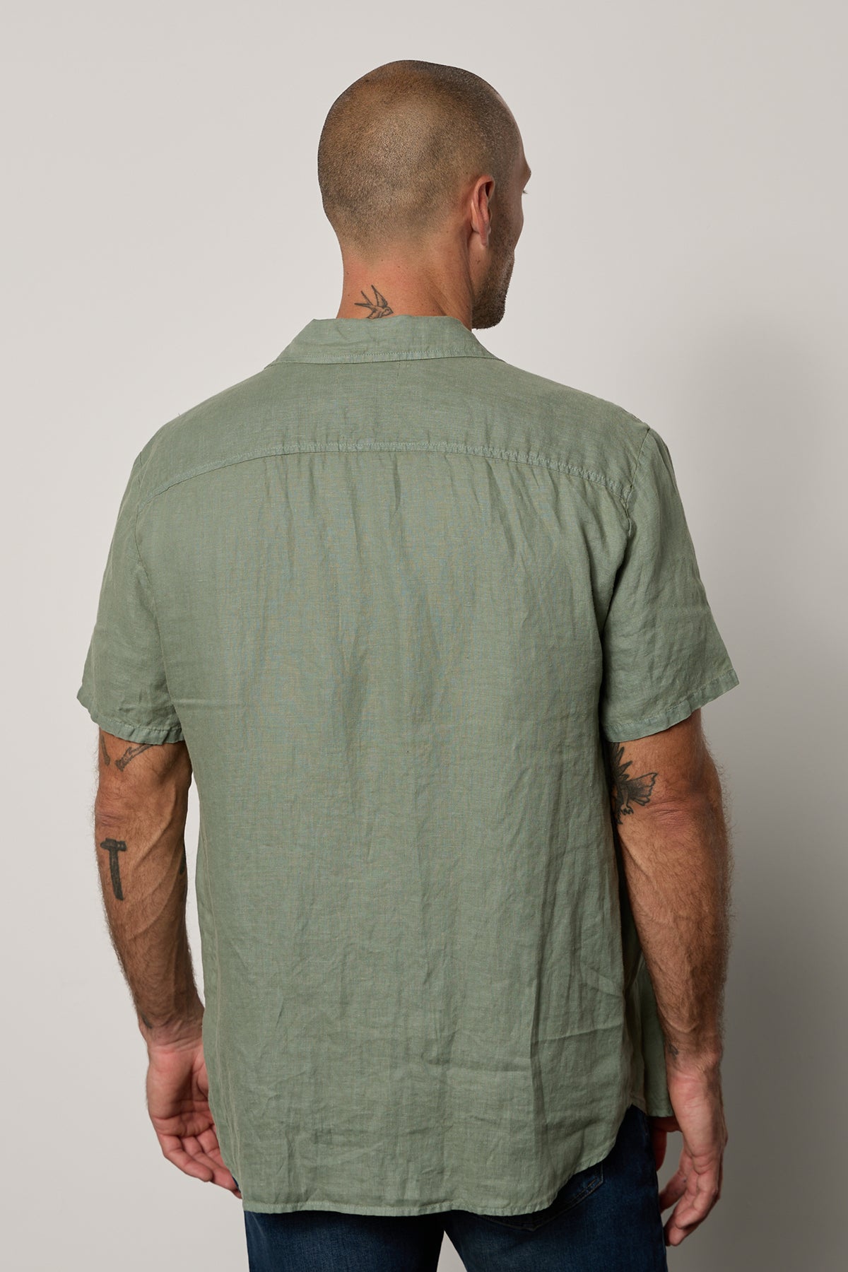Mackie Button-Up Shirt in cactus soft green with dark blue denim back-26343180959937