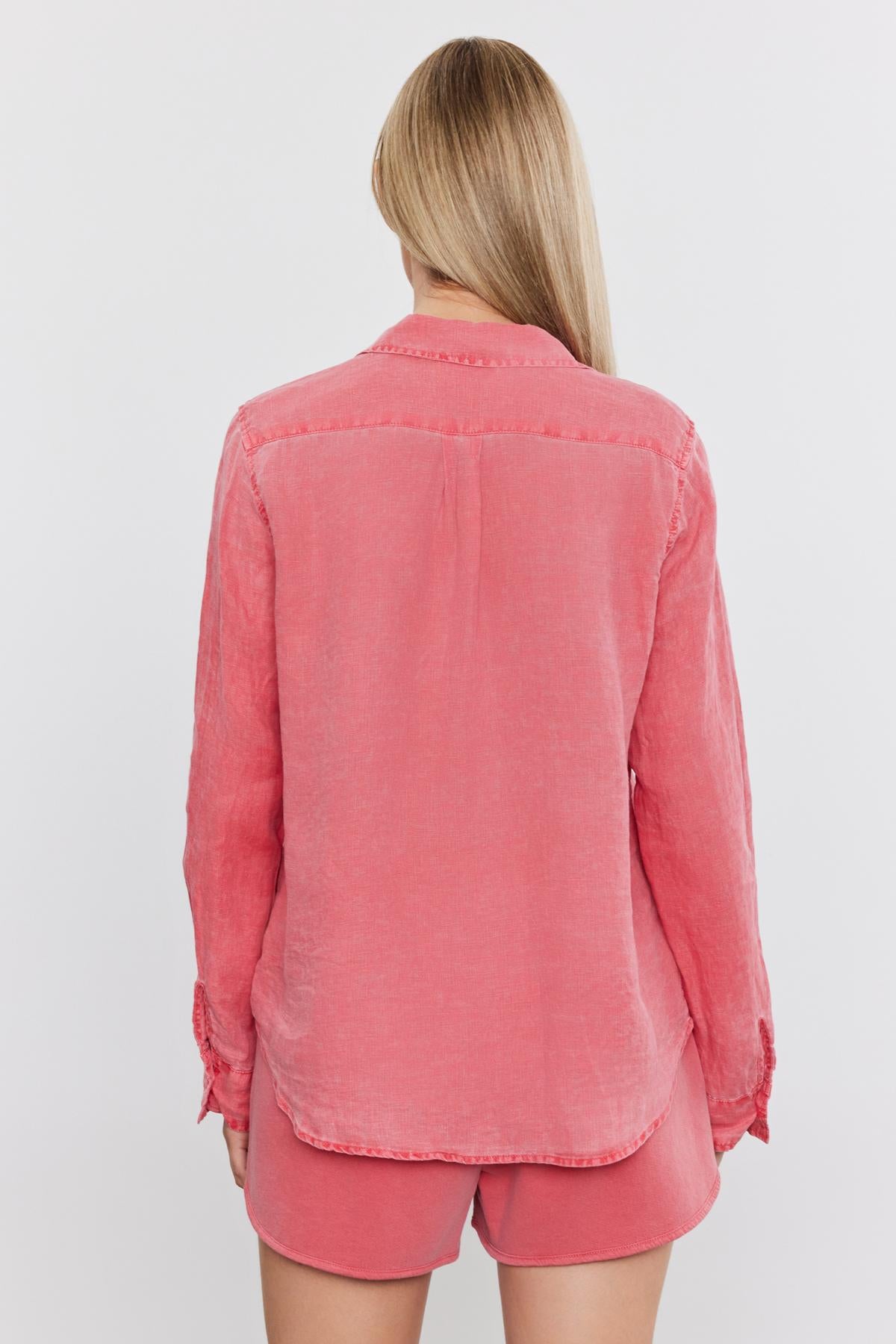 Rear view of a woman wearing a Velvet by Graham & Spencer NATALIA LINEN BUTTON-UP SHIRT and matching shorts, standing against a white background.-36910075805889