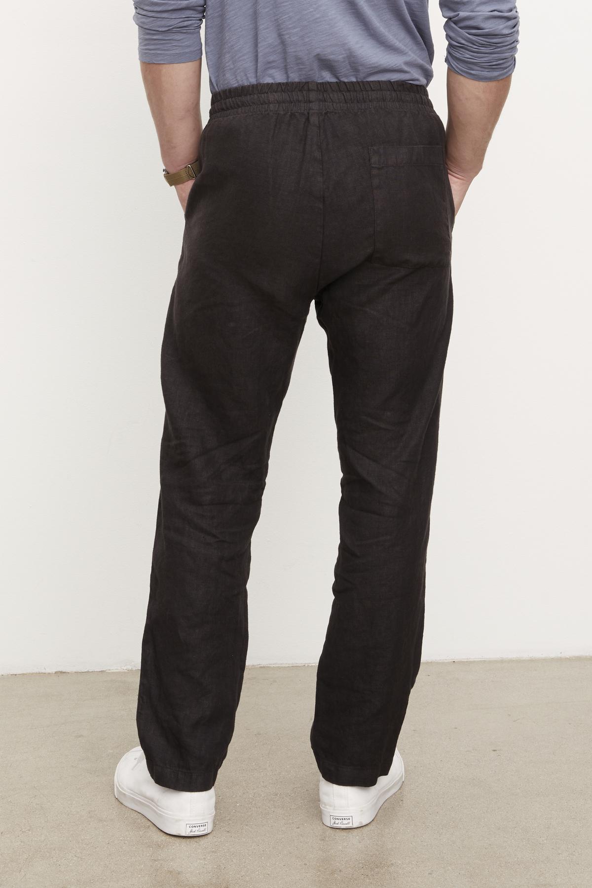 The back view of a man wearing Velvet by Graham & Spencer's Phelan Linen Pant.-36009949528257