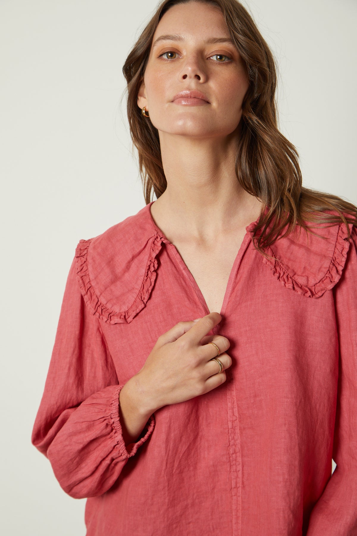The model is wearing a Sofia Linen Top by Velvet by Graham & Spencer with a ruffled collar.-26445319930049