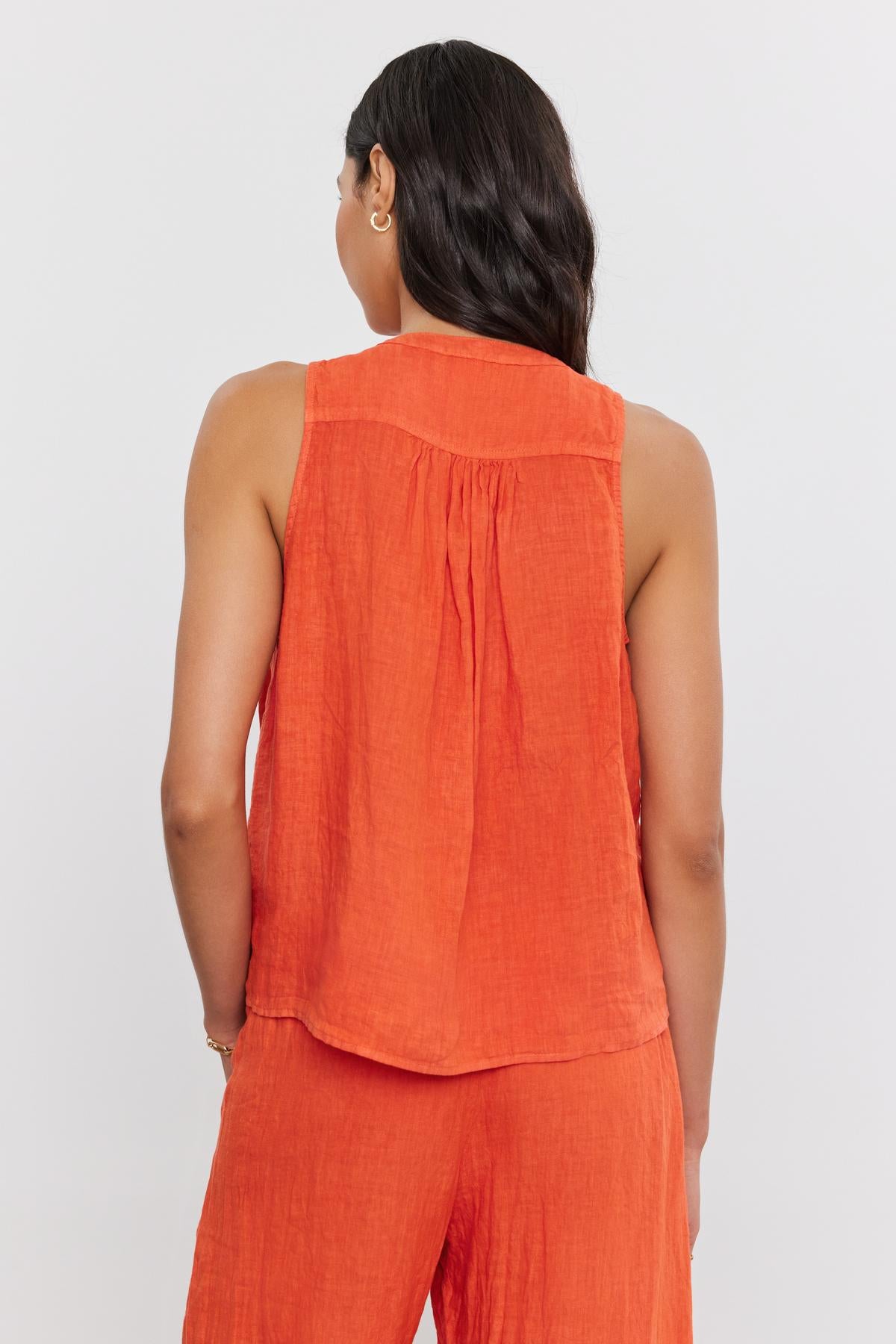   Woman with dark hair wearing a Velvet by Graham & Spencer Tacy Linen Tank Top, viewed from the back. 