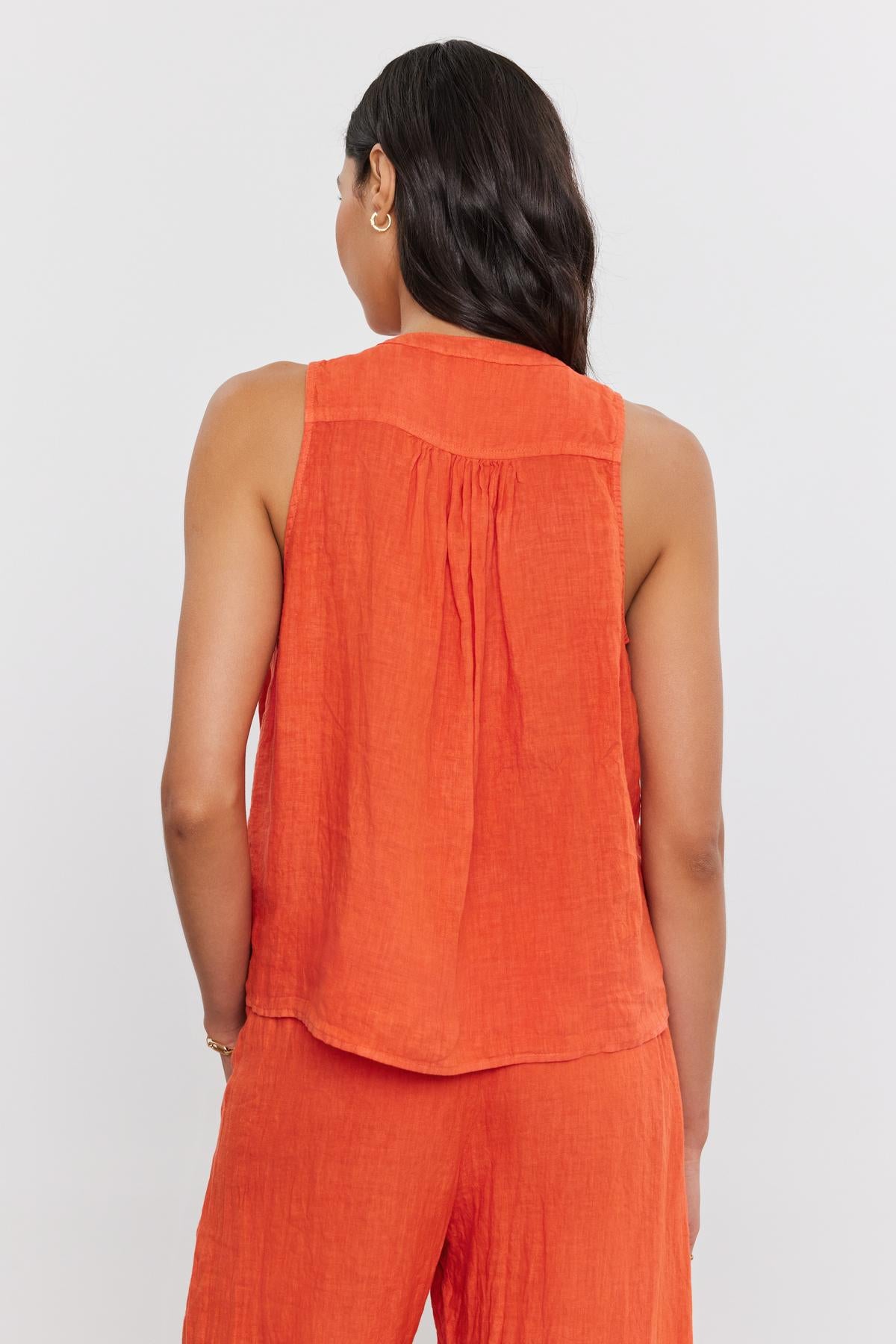 Woman with dark hair wearing a Velvet by Graham & Spencer Tacy Linen Tank Top, viewed from the back.-36909998506177