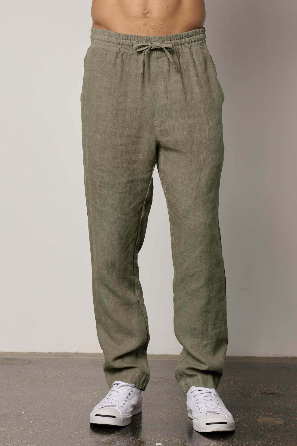 A man wearing a Velvet by Graham & Spencer VANN LINEN PANT.-26311058391233