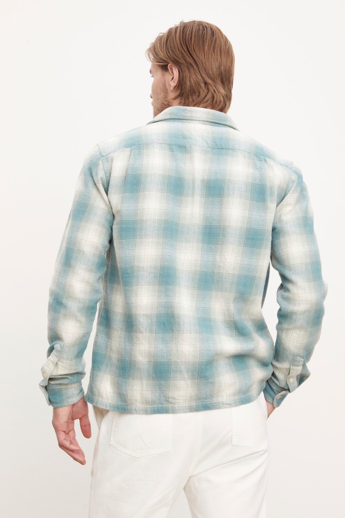   The back view of a man wearing a Velvet by Graham & Spencer ANDREW BUTTON-UP SHIRT. 