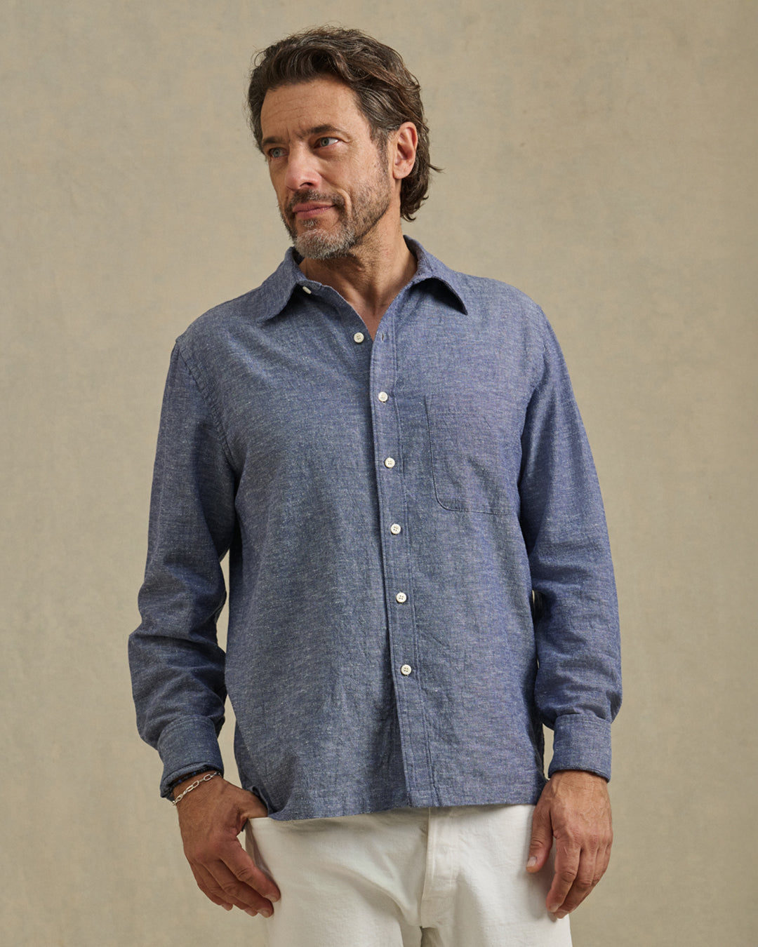 A man wearing the Antoine Shirt in Indigo by Velvet by Graham & Spencer.