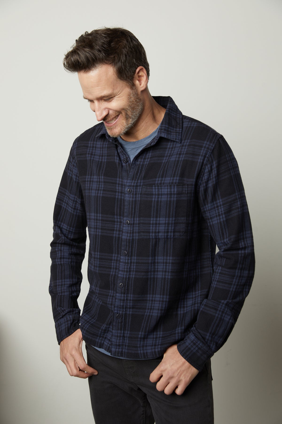   A man wearing a warm Velvet by Graham & Spencer Freddy Plaid Shirt. 