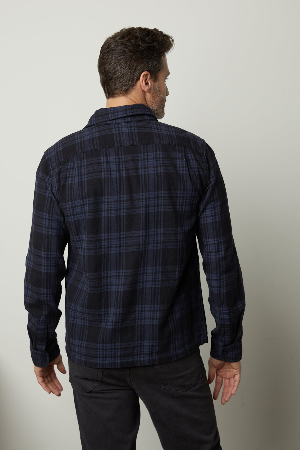 The back view of a man wearing a Velvet by Graham & Spencer FREDDY PLAID SHIRT.-35662725480641