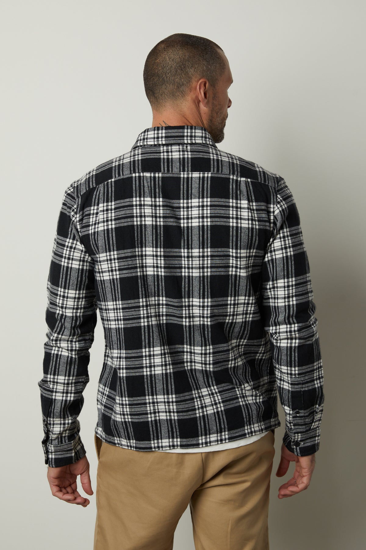 The back view of a man wearing a Velvet by Graham & Spencer FREDDY PLAID SHIRT.-35662725316801
