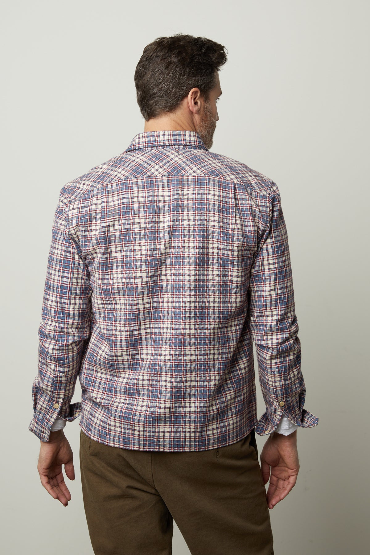 The back view of a man wearing a Velvet by Graham & Spencer STAN PLAID BUTTON-UP SHIRT.-26846194925761