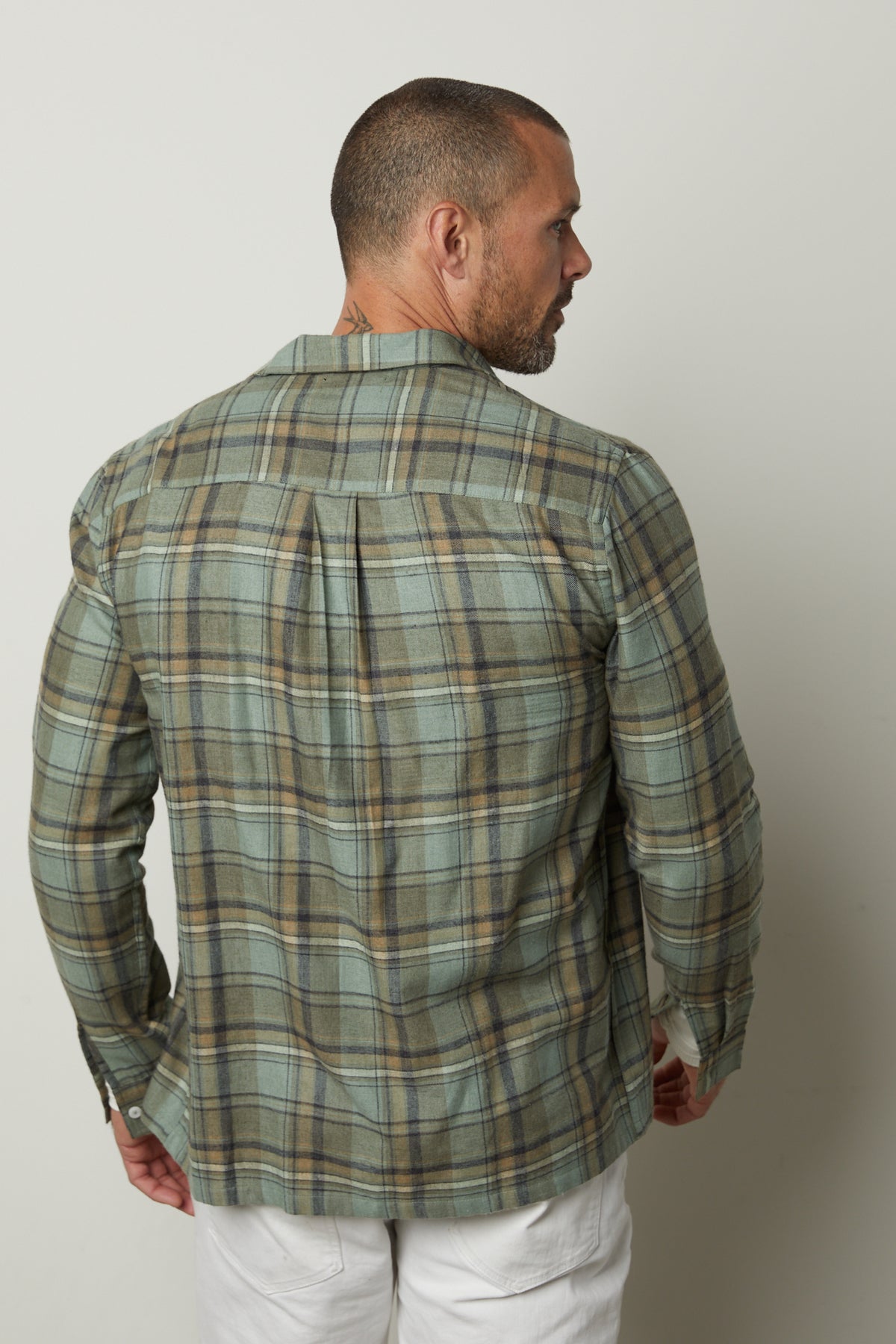 The back view of a man wearing a Velvet by Graham & Spencer TIMOTHY PLAID BUTTON-UP SHIRT.-26768086040769