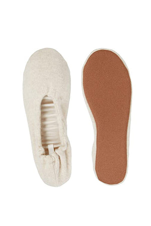 A pair of Cashmere Ballet Flat Slippers by Skin on a white surface, exuding timeless elegance.