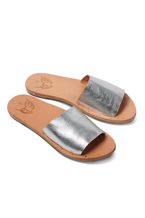 a pair of MOCKINGBIRD SANDAL BY BEEK slide sandals on a white background.