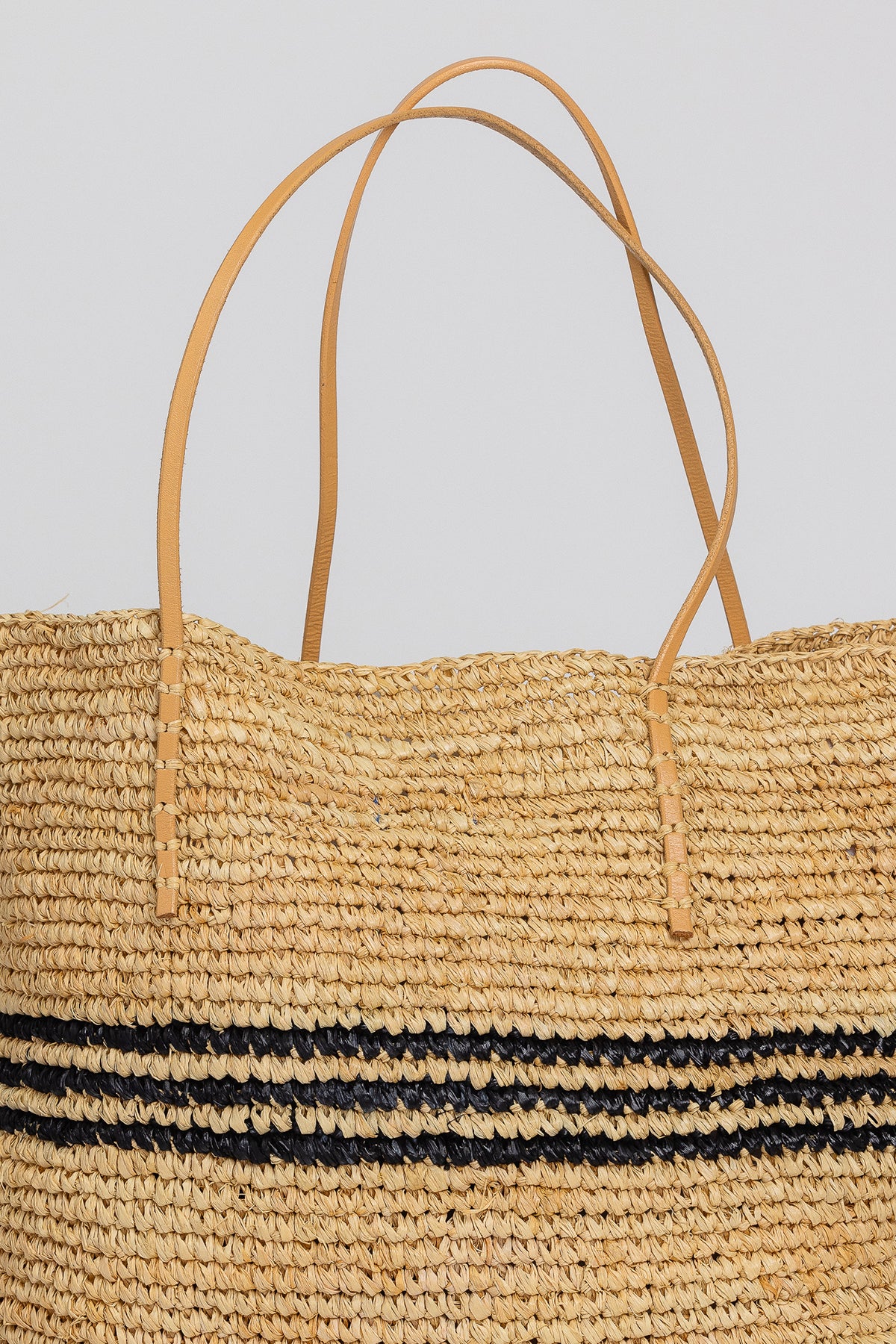   a LUXE STRIPE STRAW TOTE by Velvet by Graham & Spencer on a white background. 