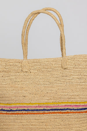 A lightweight IRIS TOTE by Velvet by Graham & Spencer with a colorful stripe, perfect for packing.
