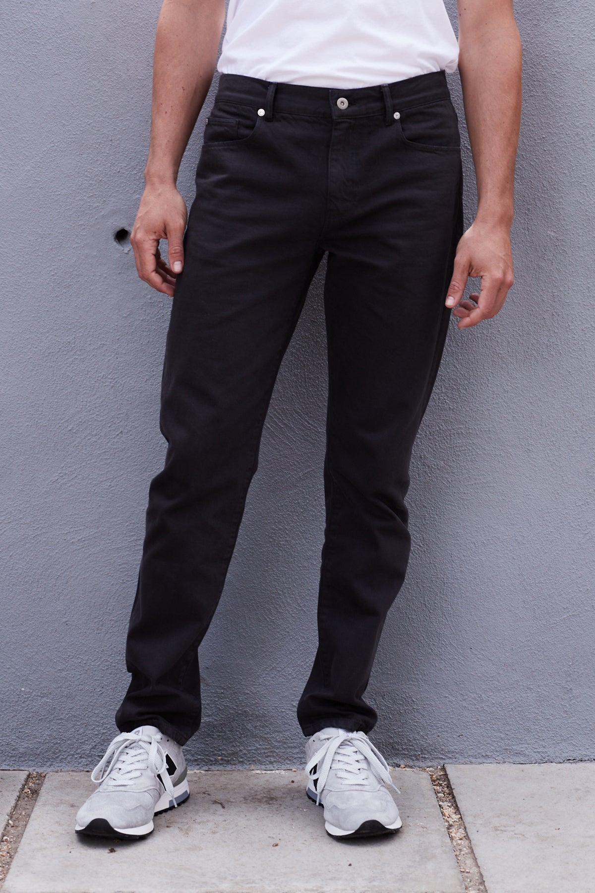 a man wearing JOSEPH COTTON CANVAS PANT jeans and a white t-shirt by Velvet by Graham & Spencer.-25083081523393