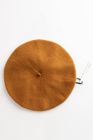 A GIGI BERET BY HANSEL FROM BASEL made of a Merino wool blend on a white surface.