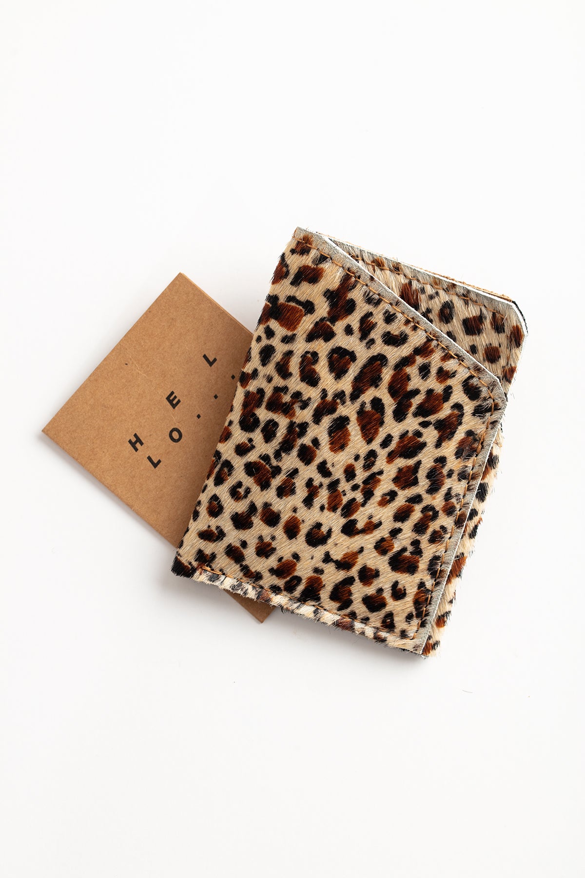   A SOFT LEATHER CARD HOLDER BY LIMA SAGRADA, crafted by local artisans, showcased against a minimalistic white background. 