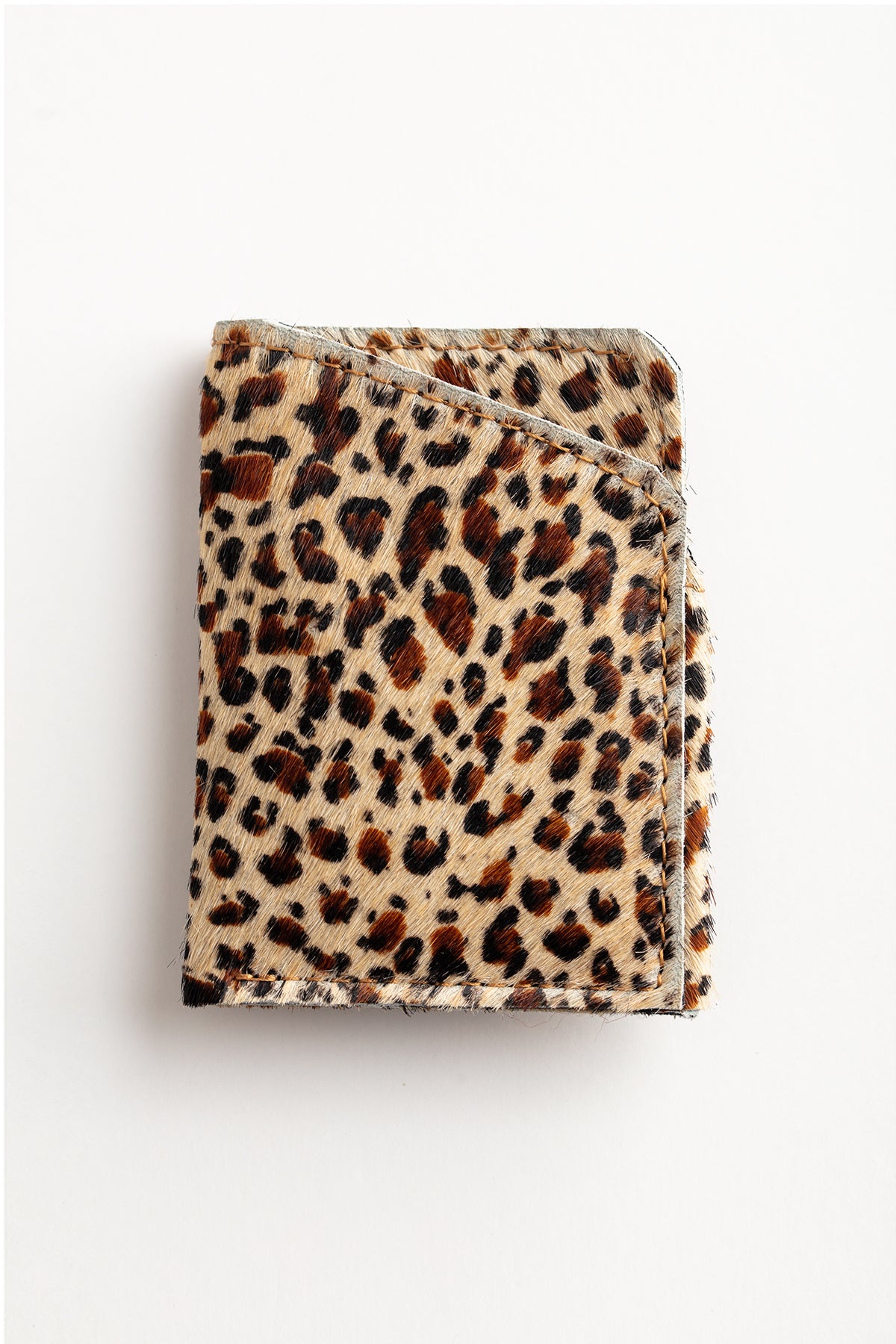   A minimalist leopard print SOFT LEATHER CARD HOLDER created by local artisans, Lima Sagrada. 