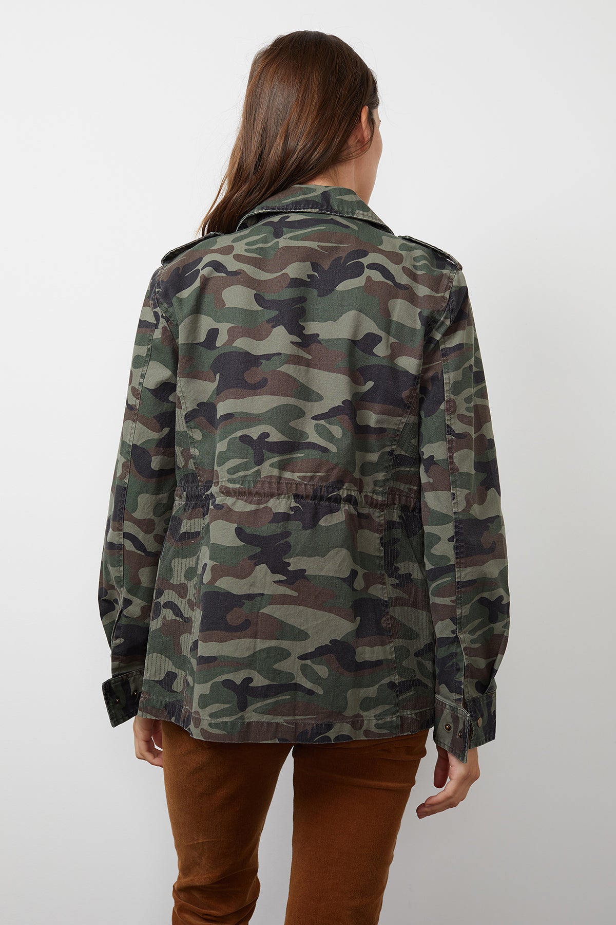   The back view of a woman wearing a Velvet by Graham & Spencer RUBY LIGHT-WEIGHT ARMY JACKET. 