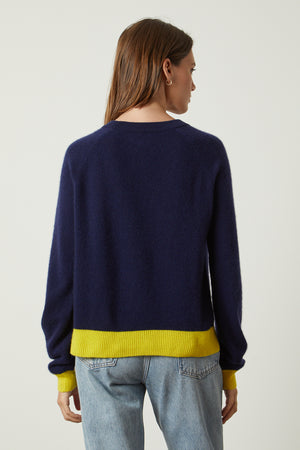 Claire Sweater in navy with yellow contrast at the cuffs and hemline with blue denim back