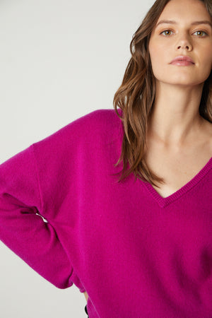 Amika Cashmere V-Neck Sweater in bright magenta pink front close up to see v-neck detail