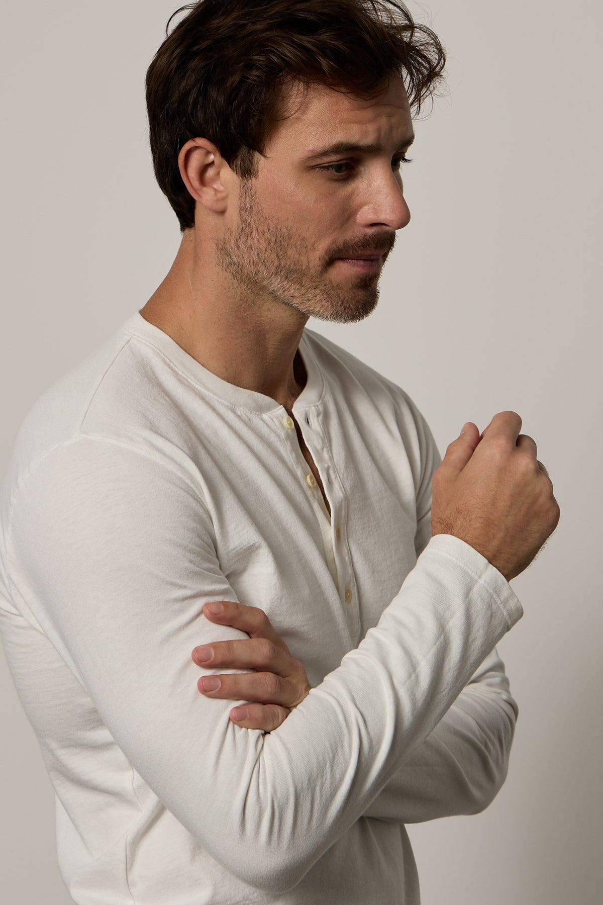 a man wearing a white Velvet by Graham & Spencer BRAD HENLEY shirt.-26184037073089