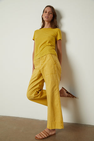 A woman wearing a Velvet by Graham & Spencer SIERRA CREW NECK TEE.