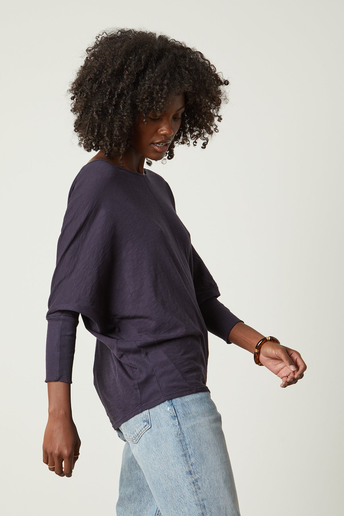 a woman wearing jeans and a Velvet by Graham & Spencer JOSS DOLMAN SLEEVE TEE.-26235745632449
