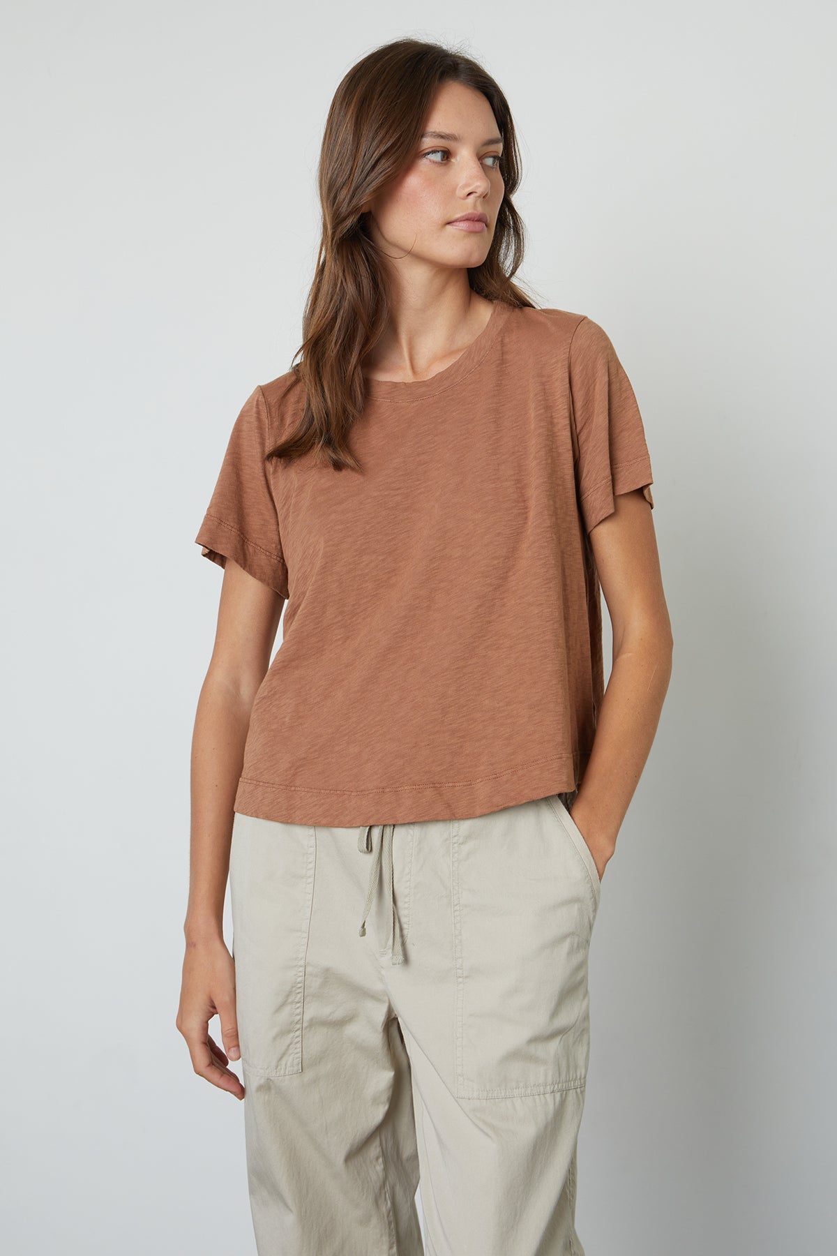 The model is wearing a Velvet by Graham & Spencer LULA COTTON SLUB SWING TEE.-25796750934209