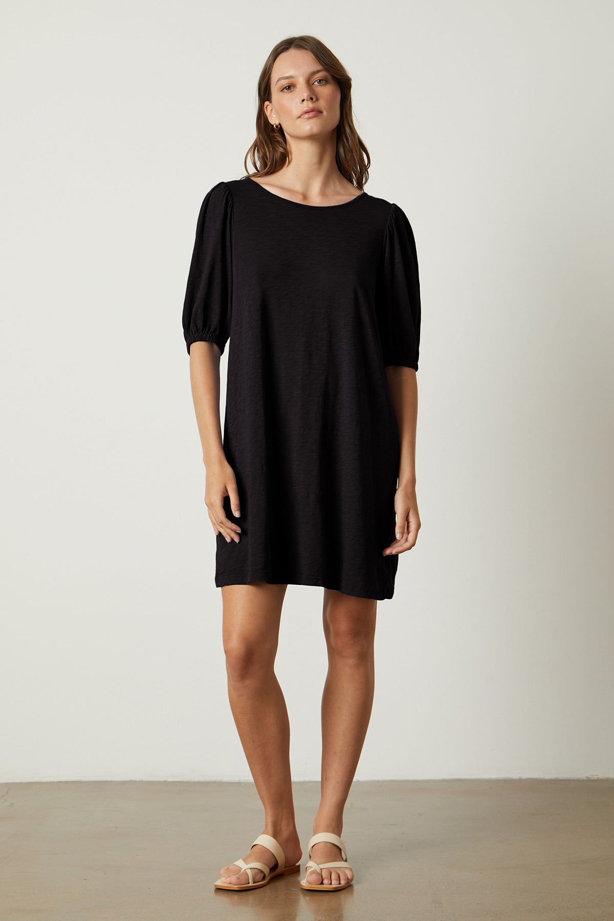 Meghan Dress in black with puff sleeves full length front-26022634815681