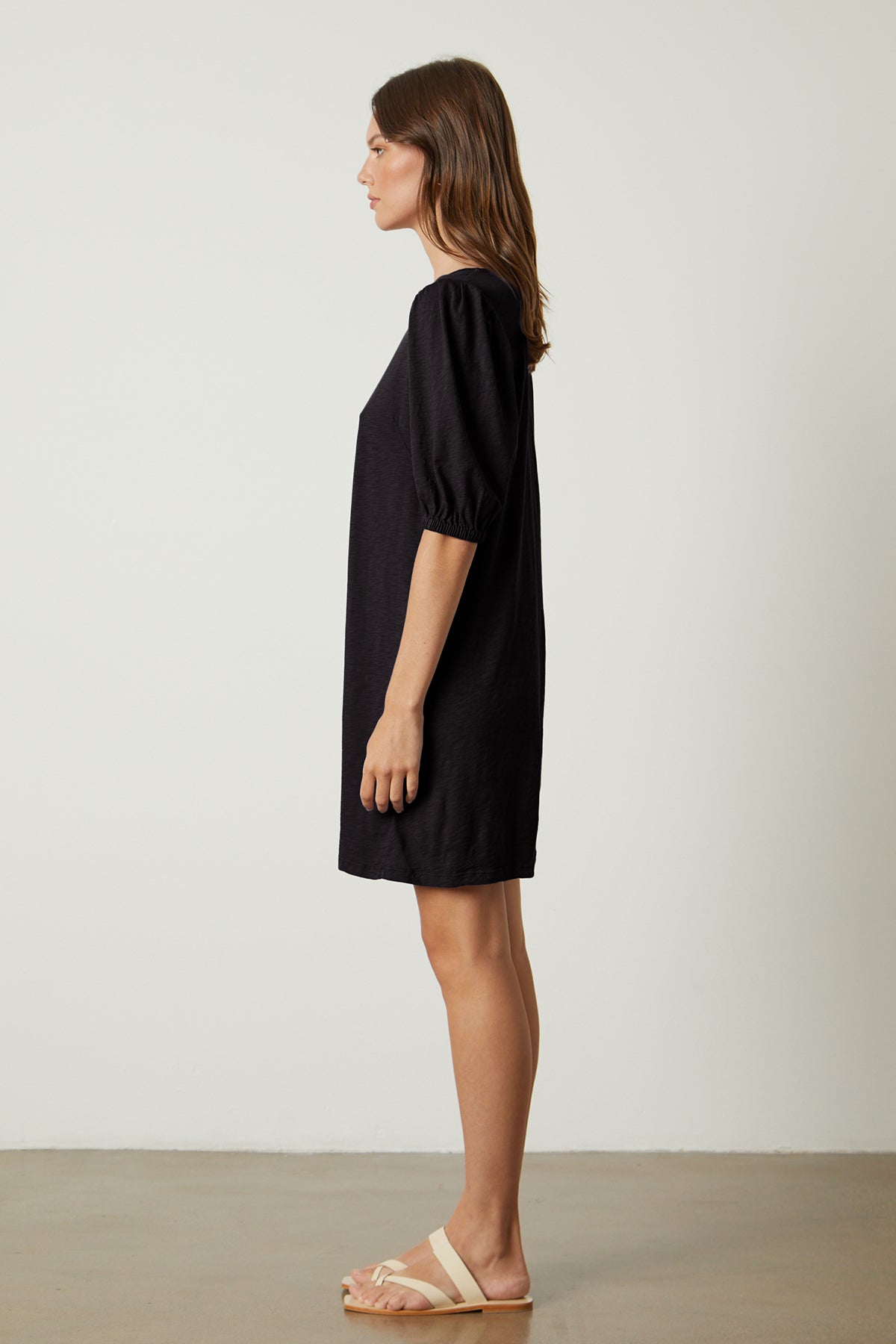   Meghan Dress in black with puff sleeves full length side 