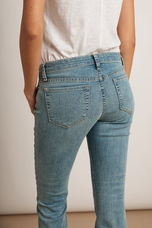 The classic back view of a woman wearing Velvet by Graham & Spencer's TONI SKINNY JEAN.