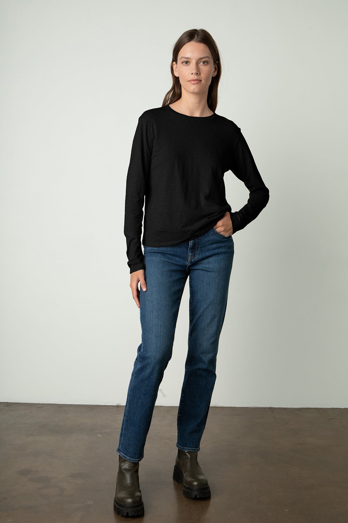   the model is wearing a black HESTER CREW NECK TEE and jeans from Velvet by Graham & Spencer. 